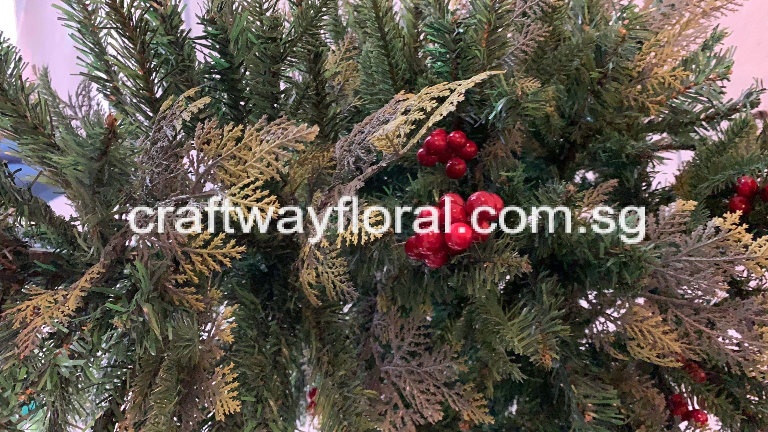 Atificial Cypress Christmas tree with Berries Closeup Artificial Cypress Christmas Tree with Berries